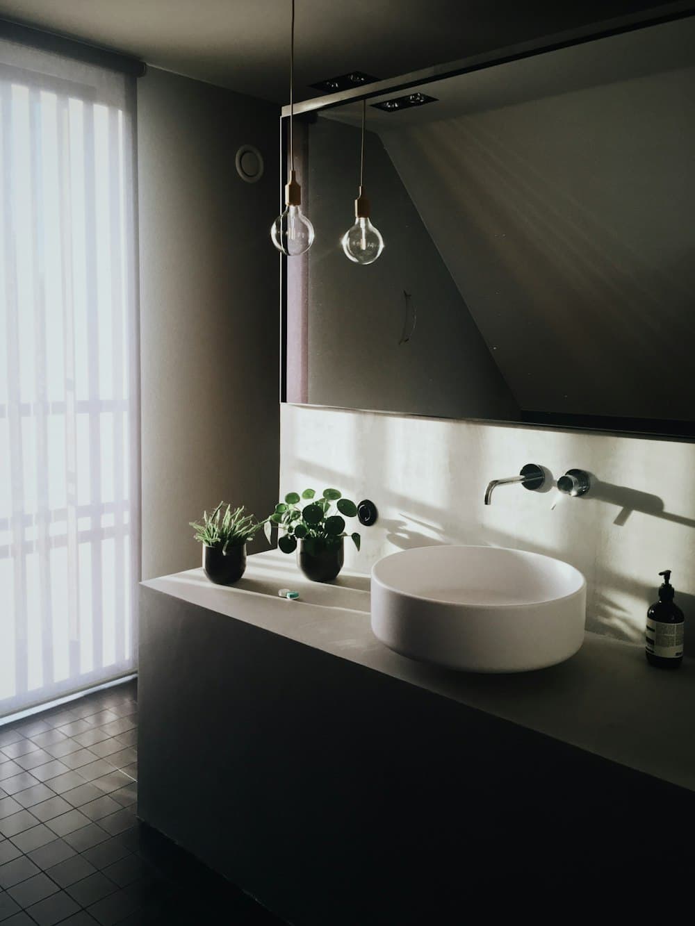 Close-up of a chrome tap and basin (illustrative)